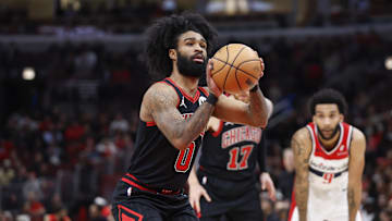 Mar 25, 2024; Chicago, Illinois, USA; Chicago Bulls guard Coby White (0) shoots a free throw against the Washington Wizards during the first half at United Center. Mandatory Credit: Kamil Krzaczynski-Imagn Images