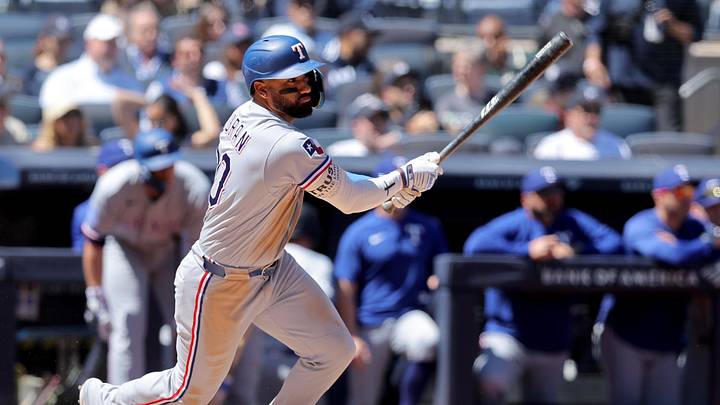 May 7, 2026; Bronx, New York, USA; Texas Rangers left fielder Ezequiel Duran (20) follows through on an RBI single against the New York Yankees during the fifth inning at Yankee Stadium. Mandatory Credit: Brad Penner-Imagn Images