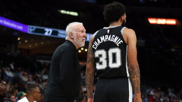 Apr 9, 2024; Memphis, Tennessee, USA; San Antonio Spurs head coach Gregg Popovich (left) talks with forward Julian Champagnie (30) during the first half against the Memphis Grizzlies at FedExForum. Mandatory Credit: Petre Thomas-USA TODAY Sports