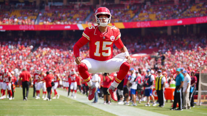 Aug 17, 2024; Kansas City, Missouri, USA; Kansas City Chiefs quarterback Patrick Mahomes (15) celebrates toward fans against the Detroit Lions prior to a game at GEHA Field at Arrowhead Stadium.