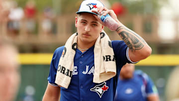 Mar 21, 2024; Bradenton, Florida, USA; Toronto Blue Jays pitcher Ricky Tiedemann (70) walks to the dugout before the game against the Pittsburgh Pirates at LECOM Park. Mandatory Credit: Kim Klement Neitzel-Imagn Images