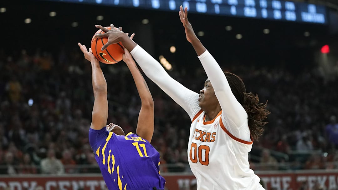Feb 5, 2026; Austin, Texas, USA; Texas Longhorns center Kyla Oldacre (00) blocks LSU Tigers guard ZaKiyah Johnson (4) during the first half at Moody Center. Mandatory Credit: Dustin Safranek-Imagn Images Feb 5, 2026; Austin, Texas, USA; Texas Longhorns center Kyla Oldacre (00) blocks LSU Tigers guard ZaKiyah Johnson (4) during the first half at Moody Center. Mandatory Credit: Dustin Safranek-Imagn Images