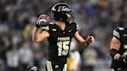 Purdue Boilermakers quarterback Ryan Browne (15) throws a pass