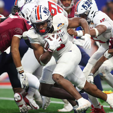 Dec 14, 2024; Atlanta, GA, USA; Jackson State Tigers running back Irv Mulligan (5) runs for a touchdown against the South Carolina State Bulldogs in the fourth quarter at Mercedes-Benz Stadium. Mandatory Credit: Brett Davis-Imagn Images
