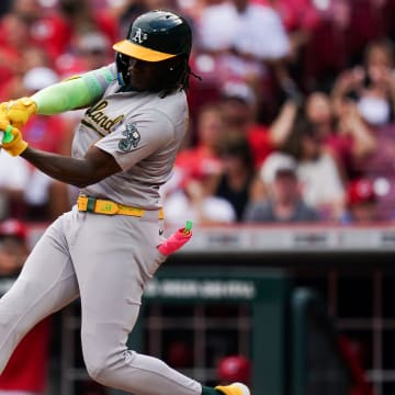 Oakland Athletics right fielder Lawrence Butler (4) hits the ball during the fourth inning of the MLB game between the Cincinnati Reds and Oakland Athletics on Aug 29.