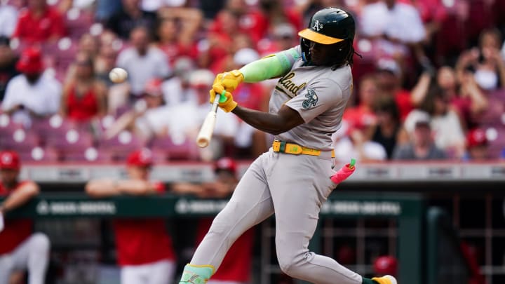 Oakland Athletics right fielder Lawrence Butler (4) hits the ball during the fourth inning of the MLB game between the Cincinnati Reds and Oakland Athletics on Aug 29.