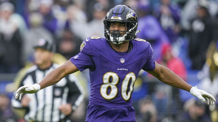 Dec 10, 2023; Baltimore, Maryland, USA;  Baltimore Ravens tight end Isaiah Likely (80) celebrates his touchdown against the Los Angeles Rams during the first quarter at M&T Bank Stadium. Mandatory Credit: Jessica Rapfogel-Imagn Images