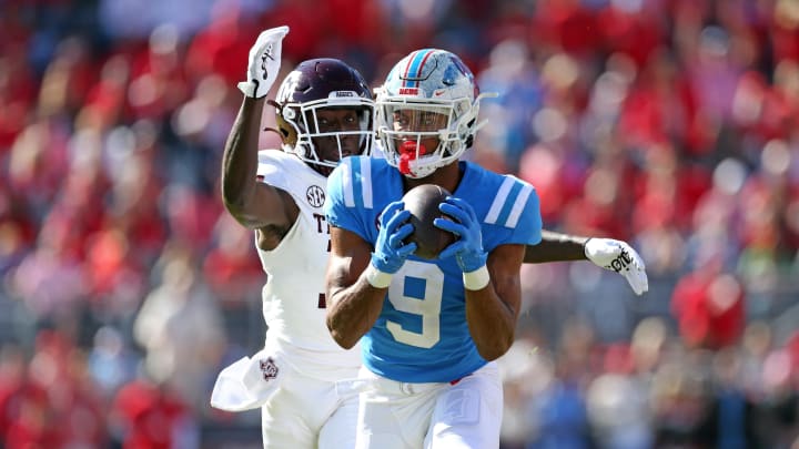 Nov 4, 2023; Oxford, Mississippi, USA; Mississippi Rebels wide receiver Tre Harris (9) catches the ball against Texas A&M Aggies defensive back Sam McCall (16) during the first half at Vaught-Hemingway Stadium. Mandatory Credit: Petre Thomas-USA TODAY Sports