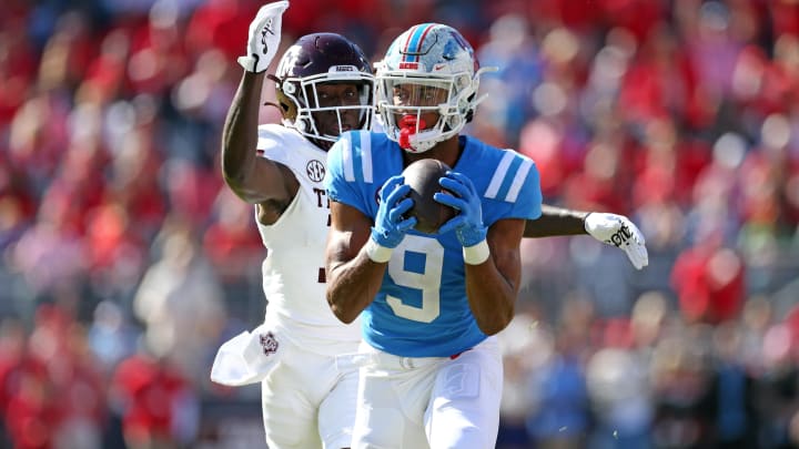 Nov 4, 2023; Oxford, Mississippi, USA; Mississippi Rebels wide receiver Tre Harris (9) catches the ball against Texas A&M Aggies defensive back Sam McCall (16) during the first half at Vaught-Hemingway Stadium. Mandatory Credit: Petre Thomas-USA TODAY Sports