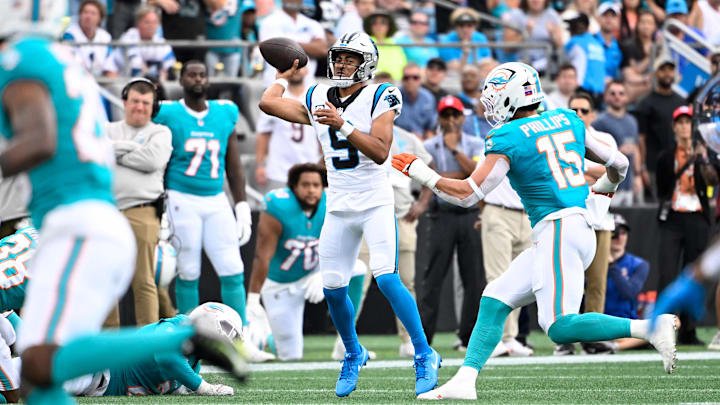 Carolina Panthers quarterback Bryce Young (9) passes the ball as Miami Dolphins linebacker Jaelan Phillips (15) pressures in the second quarter at Bank of America Stadium last Sunday. Carolina Panthers quarterback Bryce Young (9) passes the ball as Miami Dolphins linebacker Jaelan Phillips (15) pressures in the second quarter at Bank of America Stadium last Sunday.