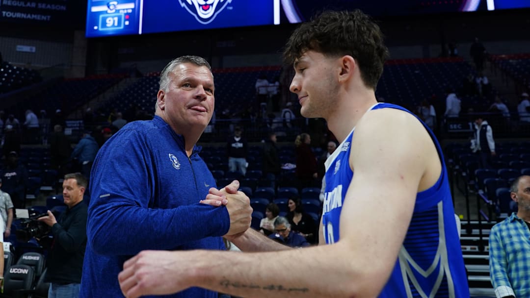 Creighton Bluejays head coach Greg McDermott congratulates guard Hudson Greer (10) after defeating the UConn Huskies at Harry A. Gampel Pavilion. 