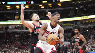 Nov 18, 2023; Chicago, Illinois, USA; Chicago Bulls guard Zach LaVine (8) defends Miami Heat forward Jimmy Butler (22) during the second half at United Center. Mandatory Credit: David Banks-Imagn Images
