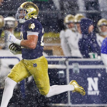 Notre Dame running back Aneyas Williams runs with the ball on his way to score a touchdown during the second half of a NCAA football game against Navy at Notre Dame Stadium on Saturday, Nov. 8, 2025, in South Bend.