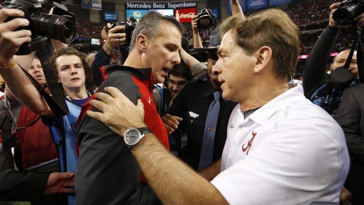 Jan 1, 2015; New Orleans, LA, USA; Ohio State Buckeyes head coach Urban Meyer and Alabama Crimson Tide head coach Nick Saban greet each other after the 2015 Sugar Bowl at Mercedes-Benz Superdome. Ohio State defeated Alabama 42-35. Mandatory Credit:  Matthew Emmons-USA TODAY Sports