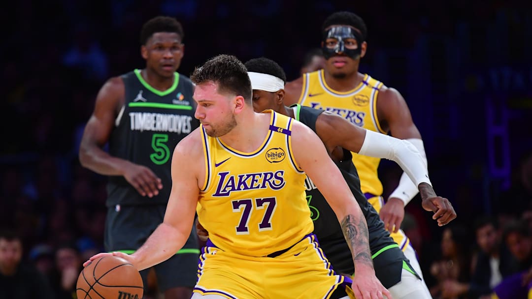 Apr 30, 2025; Los Angeles, California, USA; Los Angeles Lakers guard Luka Doncic (77) controls the ball against the Minnesota Timberwolves during the second half in game five of first round for the 2025 NBA Playoffs at Crypto.com Arena. Mandatory Credit: Gary A. Vasquez-Imagn Images