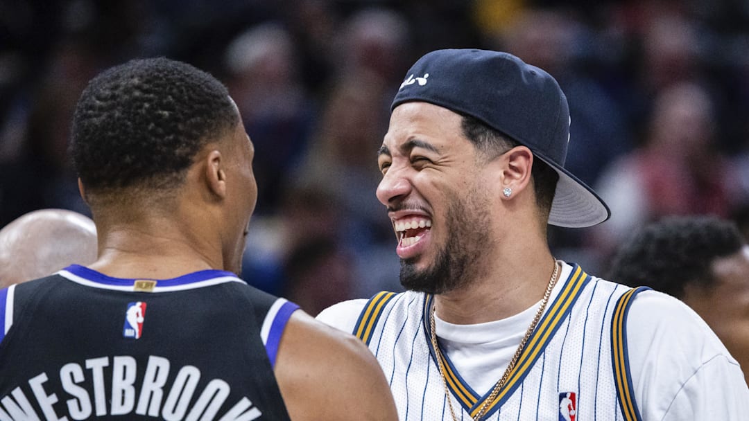 Dec 8, 2025; Indianapolis, Indiana, USA; Indiana Pacers guard Tyrese Haliburton (0) and Sacramento Kings guard Russell Westbrook (18) in the first half at Gainbridge Fieldhouse. Mandatory Credit: Trevor Ruszkowski-Imagn Images