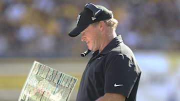 Sep 19, 2021; Pittsburgh, Pennsylvania, USA;  Las Vegas Raiders head coach Jon Gruden looks at his