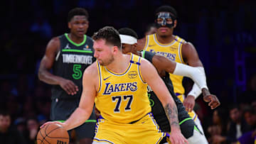 Apr 30, 2025; Los Angeles, California, USA; Los Angeles Lakers guard Luka Doncic (77) controls the ball against the Minnesota Timberwolves during the second half in game five of first round for the 2025 NBA Playoffs at Crypto.com Arena. Mandatory Credit: Gary A. Vasquez-Imagn Images