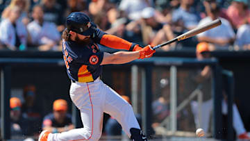 Mar 2, 2025; West Palm Beach, Florida, USA;  Houston Astros second baseman Brendan Rodgers (54) hits a single against the Washington Nationals during the second inning at CACTI Park of the Palm Beaches. 