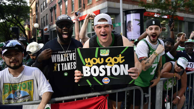 A fan holds up a poster that says "You got Boston" during the Celtics 2024 NBA championship parade.