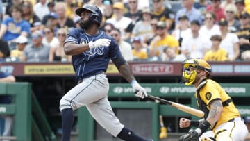 Jun 23, 2024; Pittsburgh, Pennsylvania, USA;  Tampa Bay Rays left fielder Randy Arozarena (56) hits a single against the Pittsburgh Pirates during the third inning at PNC Park.