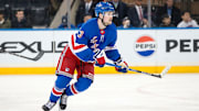 Mar 22, 2025; New York, New York, USA; New York Rangers left wing Alexis Lafreniere (13) skates against the Vancouver Canucks during the third period at Madison Square Garden. Mandatory Credit: Danny Wild-Imagn Images