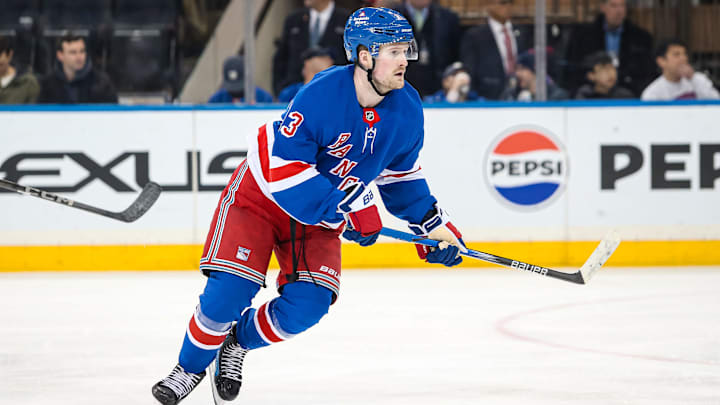 Mar 22, 2025; New York, New York, USA; New York Rangers left wing Alexis Lafreniere (13) skates against the Vancouver Canucks during the third period at Madison Square Garden. Mandatory Credit: Danny Wild-Imagn Images