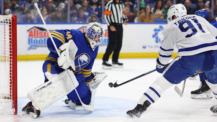 Mar 14, 2026; Buffalo, New York, USA;  Buffalo Sabres goaltender Alex Lyon (34) looks to make a save on Toronto Maple Leafs center John Tavares (91) during the first period at KeyBank Center. Mandatory Credit: Timothy T. Ludwig-Imagn Images