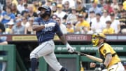 Jun 23, 2024; Pittsburgh, Pennsylvania, USA;  Tampa Bay Rays left fielder Randy Arozarena (56) hits a single against the Pittsburgh Pirates during the third inning at PNC Park.