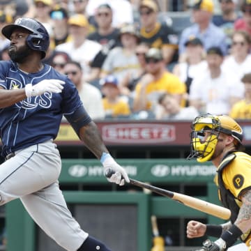 Jun 23, 2024; Pittsburgh, Pennsylvania, USA;  Tampa Bay Rays left fielder Randy Arozarena (56) hits a single against the Pittsburgh Pirates during the third inning at PNC Park.