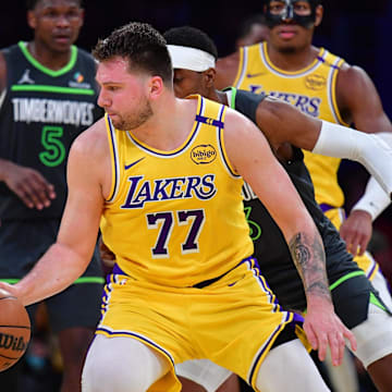 Apr 30, 2025; Los Angeles, California, USA; Los Angeles Lakers guard Luka Doncic (77) controls the ball against the Minnesota Timberwolves during the second half in game five of first round for the 2025 NBA Playoffs at Crypto.com Arena. Mandatory Credit: Gary A. Vasquez-Imagn Images
