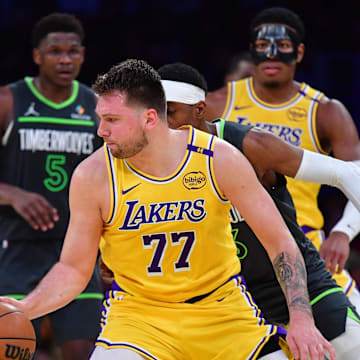 Apr 30, 2025; Los Angeles, California, USA: Los Angeles Lakers guard Luka Doncic (77) controls the ball against the Minnesota Timberwolves during the second half in game five of first round for the 2025 NBA Playoffs at Crypto.com Arena. Mandatory Credit: Gary A. Vasquez-Imagn Images