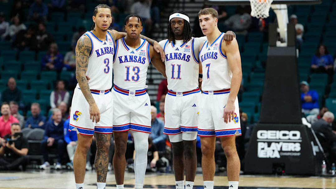 Nov 24, 2025; Las Vegas, Nevada, USA; Kansas Jayhawks guard Tre White (3), guard Elmarko Jackson (13), guard Jamari McDowell (11) and guard Kohl Rosario (7) huddle during technical foul free throws during the first half against the Notre Dame Fighting Irish in a 2025 Players Era Festival group play game at MGM Grand Garden Arena. Mandatory Credit: Stephen R. Sylvanie-Imagn Images Nov 24, 2025; Las Vegas, Nevada, USA; Kansas Jayhawks guard Tre White (3), guard Elmarko Jackson (13), guard Jamari McDowell (11) and guard Kohl Rosario (7) huddle during technical foul free throws during the first half against the Notre Dame Fighting Irish in a 2025 Players Era Festival group play game at MGM Grand Garden Arena. Mandatory Credit: Stephen R. Sylvanie-Imagn Images
