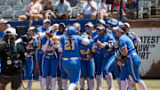 Jun 1, 2025; Oklahoma City, OK, USA;  UCLA Bruins players celebrate catcher Alexis Ramirez (28) home run in the second inning against the Tennessee Lady Volunteers during the NCAA Softball Women's College World Series at Devon Park. Mandatory Credit: Brett Rojo-Imagn Images