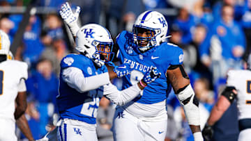 Nov 16, 2024; Lexington, Kentucky, USA; Kentucky Wildcats defensive lineman Keeshawn Silver (9) celebrates with defensive back Jordan Lovett (25) after Lovett intercepts a pass during the second quarter against the Murray State Racers at Kroger Field. Mandatory Credit: Jordan Prather-Imagn Images