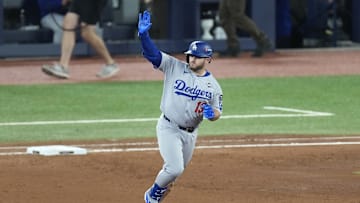 Nov 1, 2025; Toronto, Ontario, CAN; Los Angeles Dodgers third baseman Max Muncy (13) runs after hitting a home run against the Toronto Blue Jays in the eighth inning during game seven of the 2025 MLB World Series at Rogers Centre. Mandatory Credit: Kevin Sousa-Imagn Images
