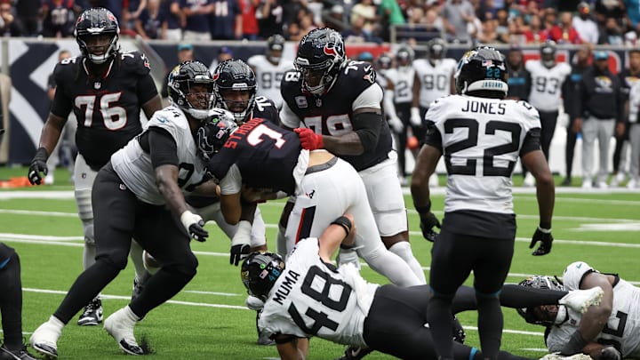 Sep 29, 2024; Houston, Texas, USA; Houston Texans quarterback C.J. Stroud (7) is tackled by Jacksonville Jaguars linebacker Chad Muma (48) in the second half at NRG Stadium. Mandatory Credit: Thomas Shea-Imagn Images Sep 29, 2024; Houston, Texas, USA; Houston Texans quarterback C.J. Stroud (7) is tackled by Jacksonville Jaguars linebacker Chad Muma (48) in the second half at NRG Stadium. Mandatory Credit: Thomas Shea-Imagn Images