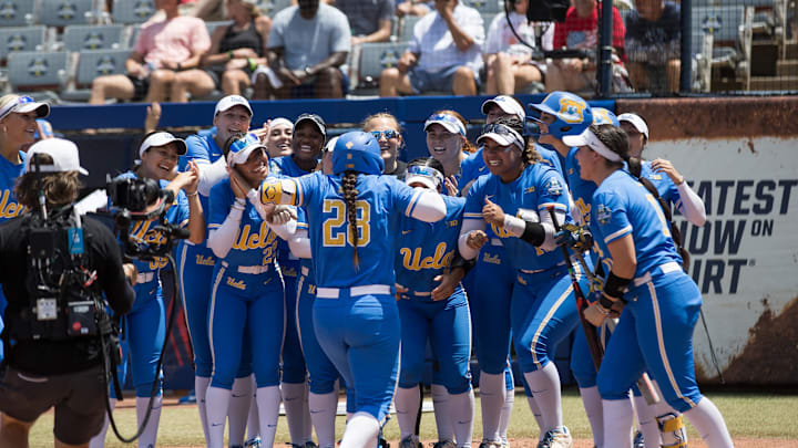 Jun 1, 2025; Oklahoma City, OK, USA; UCLA Bruins players celebrate catcher Alexis Ramirez (28) home run in the second inning against the Tennessee Lady Volunteers during the NCAA Softball Women's College World Series at Devon Park. Mandatory Credit: Brett Rojo-Imagn Images Jun 1, 2025; Oklahoma City, OK, USA; UCLA Bruins players celebrate catcher Alexis Ramirez (28) home run in the second inning against the Tennessee Lady Volunteers during the NCAA Softball Women's College World Series at Devon Park. Mandatory Credit: Brett Rojo-Imagn Images