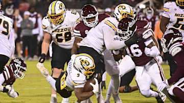 Nov 23, 2024; Starkville, Mississippi, USA;  Missouri Tigers running back Marcus Carroll (9) dives for extra yardage against the Mississippi State Bulldogs during the fourth quarter at Davis Wade Stadium at Scott Field. Mandatory Credit: Matt Bush-Imagn Images