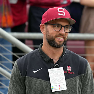 Stanford Cardinal and NFL former quarterback Andrew Luck stands on the sidelines during the second quarter against the Oregon Ducks at Stanford Stadium.