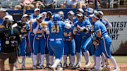 Jun 1, 2025; Oklahoma City, OK, USA;  UCLA Bruins players celebrate catcher Alexis Ramirez (28) home run in the second inning against the Tennessee Lady Volunteers during the NCAA Softball Women's College World Series at Devon Park. Mandatory Credit: Brett Rojo-Imagn Images