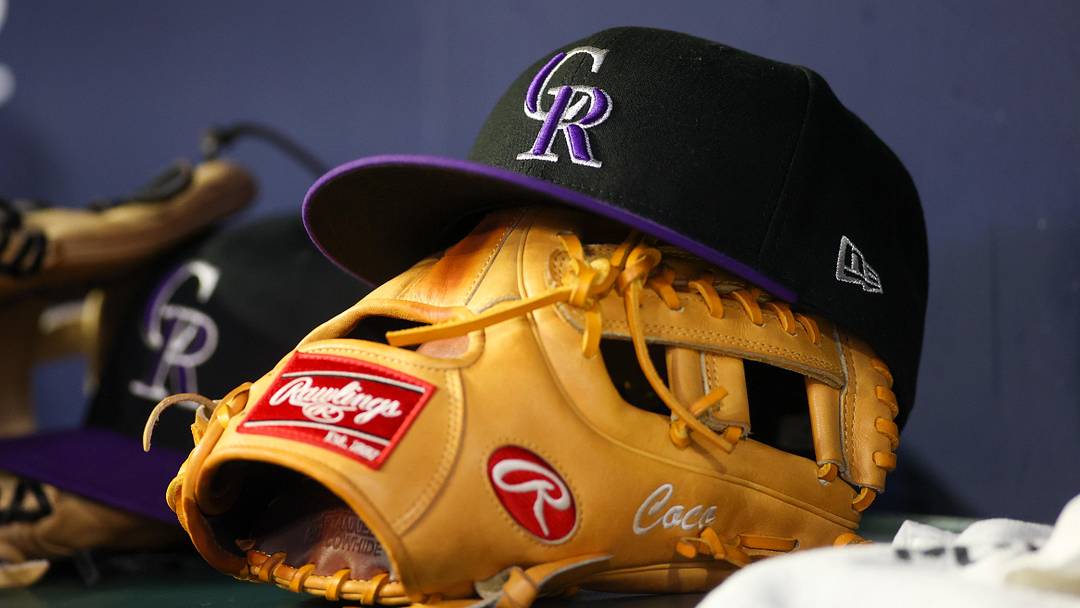 A detailed view of a Colorado Rockies hat and glove