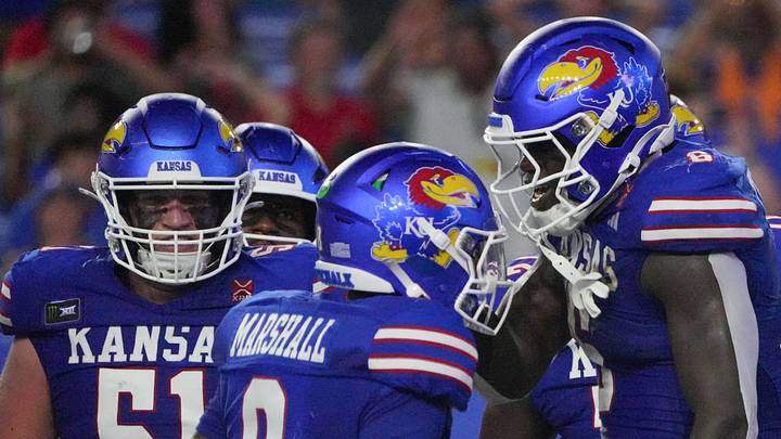 Sep 4, 2026; Lawrence, Kansas, USA; Kansas Jayhawks running back Yasin Willis (6) celebrates with quarterback Isaiah Marshall (8) after scoring against the LIU Sharks during the first half at David Booth Kansas Memorial Stadium. Mandatory Credit: Denny Medley-Imagn Images