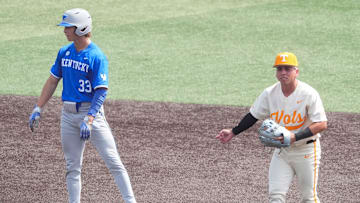 Tennessee's Ariel Antigua (2) signals he got the out against Kentucky's Kyuss Gargett (33) during an NCAA college baseball game on April 20, 2025, in Knoxville, Tenn.