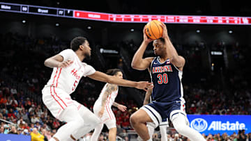 Mar 15, 2025; Kansas City, MO, USA; Arizona Wildcats forward Tobe Awaka (30) attempts to shoot the ball against Houston Cougars forward Ja'Vier Francis (5) during the second half for the Big 12 Conference Tournament Championship game at T-Mobile Center. Mandatory Credit: William Purnell-Imagn Images