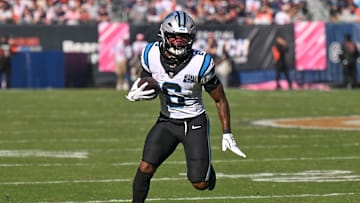 Oct 6, 2024; Chicago, Illinois, USA; Carolina Panthers running back Miles Sanders (6) runs after a catch against the Chicago Bears during the fourth quarter at Soldier Field. Mandatory Credit: Daniel Bartel-Imagn Images