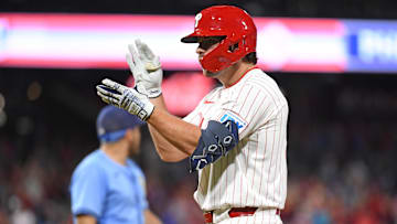 Sep 10, 2024; Philadelphia, Pennsylvania, USA; Philadelphia Phillies second base Buddy Kennedy (19) reacts after hitting an RBI single during the eighth inning against the Tampa Bay Rays at Citizens Bank Park.