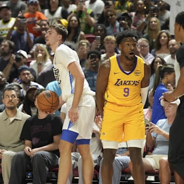 Jul 10, 2025; Las Vegas, NV, USA; Los Angeles Lakers guard Bronny James (9) reacts to a foul call against Dallas Mavericks forward Cooper Flagg (32) in the second quarter of their game at Thomas & Mack Center. Mandatory Credit: Candice Ward-Imagn Images
