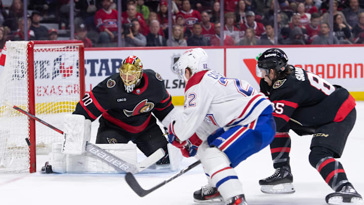 Apr 13, 2024; Ottawa, Ontario, CAN; Ottawa Senators goalie Joonas Korpisalo (70) makes a save on a shot from Montreal Canadiens right wing Cole Caufield (22) in the second period at the Canadian Tire Centre. Mandatory Credit: Marc DesRosiers-Imagn Images