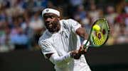 Frances Tiafoe debuts lululemon's all-white kit at Wimbledon.
